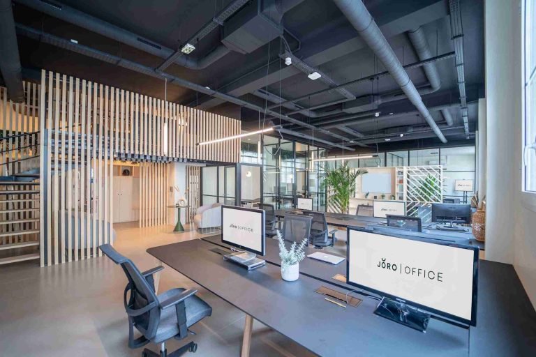 Office area with soft flooring and acoustic panels