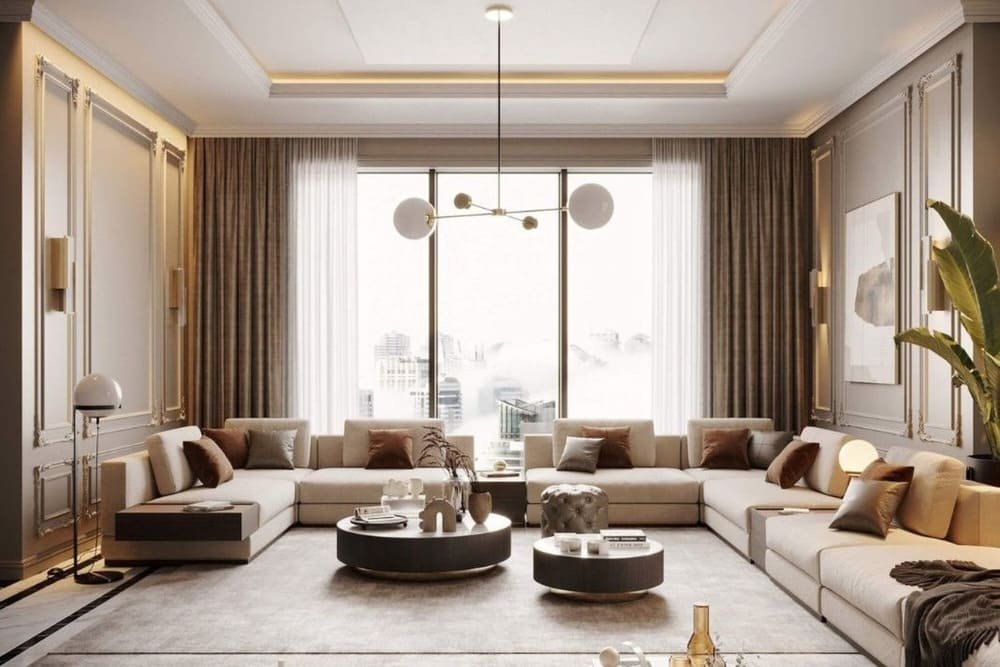 Modern living room with a large sectional sofa, central coffee tables, and decorative lighting