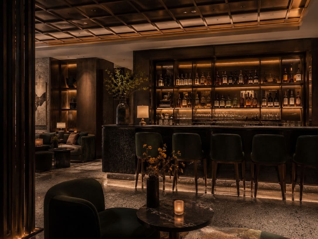 Hotel lobby bar with custom counter and lighting